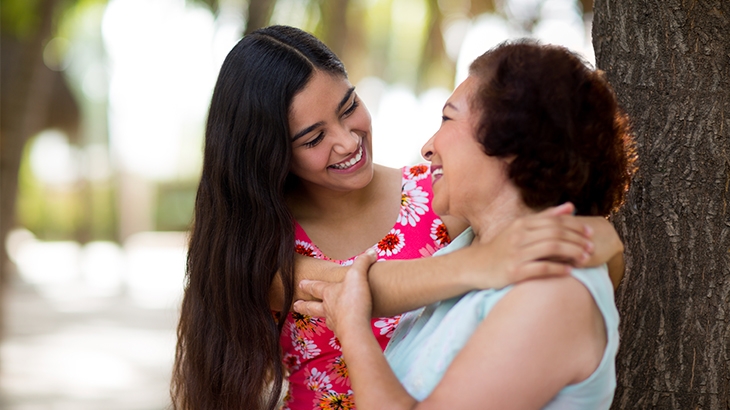 Grandmother and grandchild hugging. 