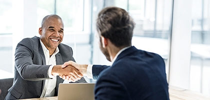 Businessmen shaking hands at a meeting in the office.