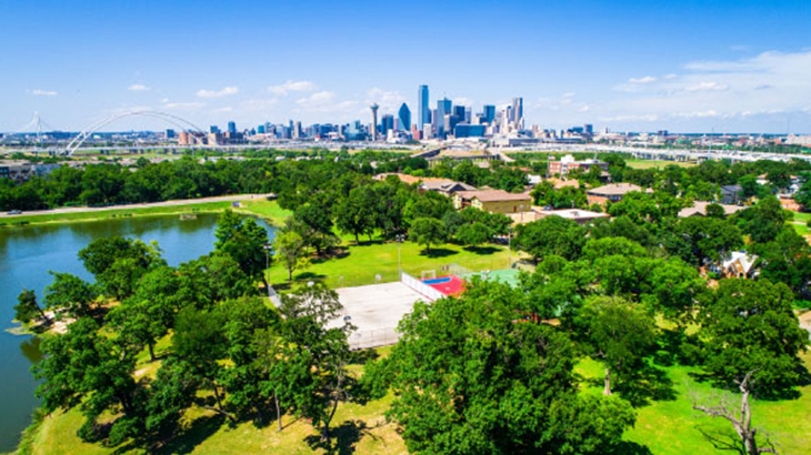 Dallas Texas suburban park with downtown skyline in background.