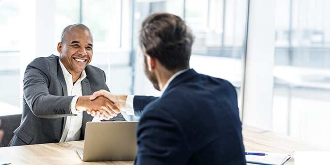 Businessmen shaking hands at a meeting in the office.