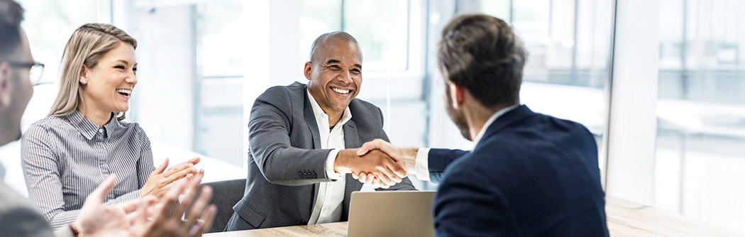 Businessmen shaking hands at a meeting in the office.