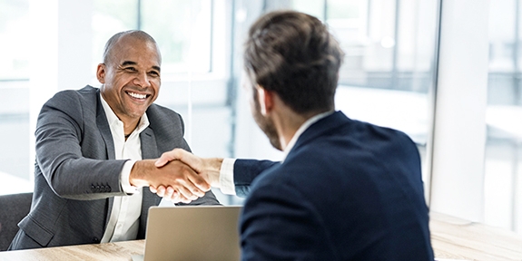 Businessmen shaking hands at a meeting in the office.