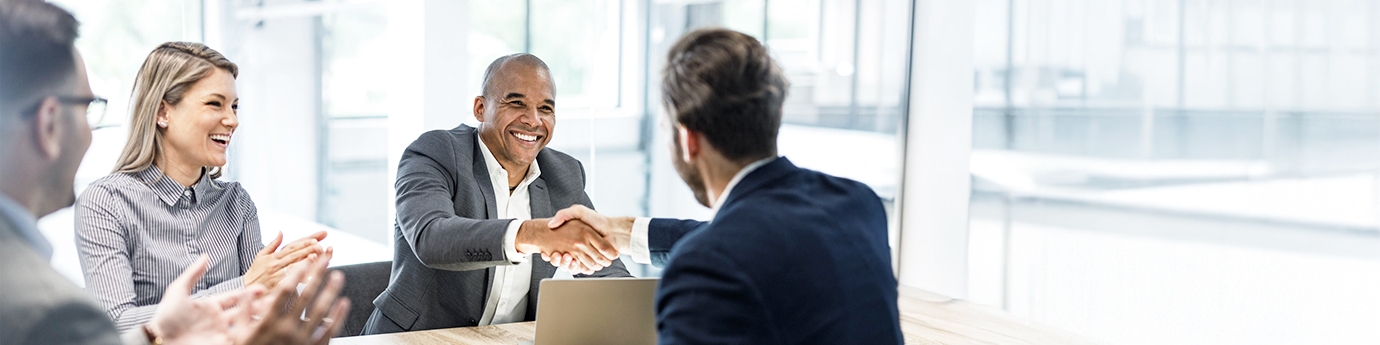 Businessmen shaking hands at a meeting in the office.