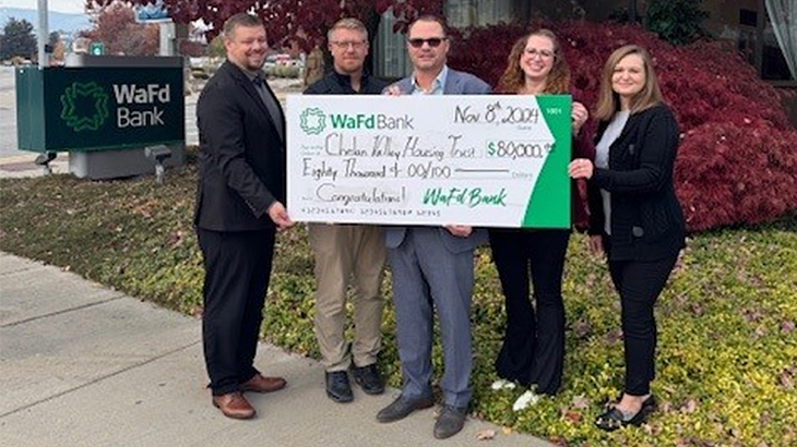 WaFd employees presenting a check to the Chelan Valley Housing Trust.