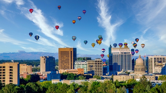 Downtown skyline in Boise, Idaho with hot air balloons.